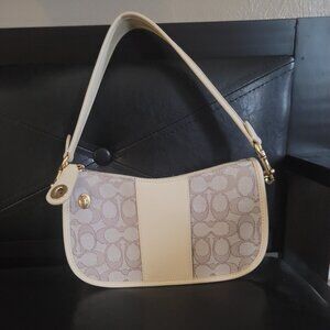 Coach Handbag come with additional crossbody strap